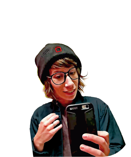 Isos Technology employee posing as a mirror selfie outlined with the company logo in the back